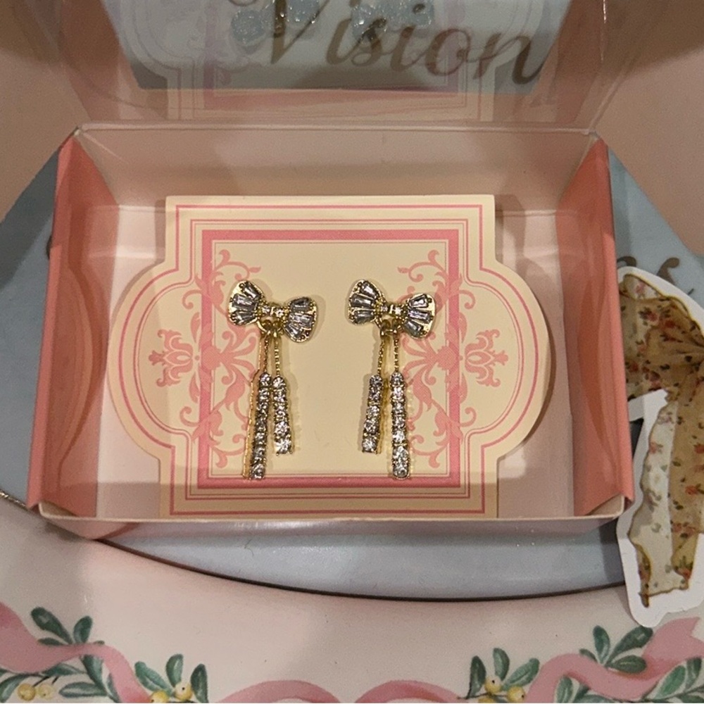 Pair of Gold Rhinestone Statement Ribbon Bow Dangle Earrings in custom packaging